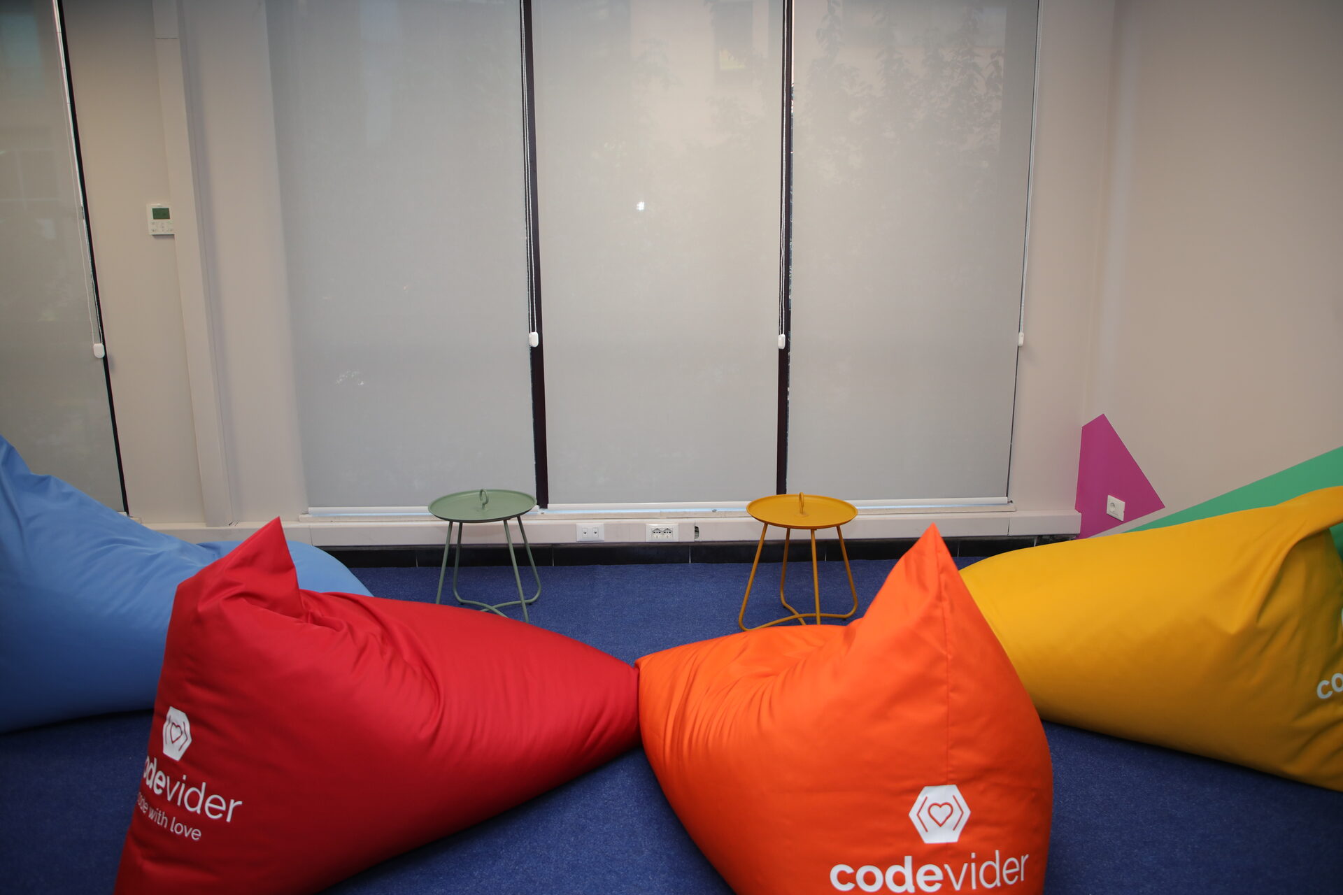 Colorful lounge area with beanbags at the Codevider office